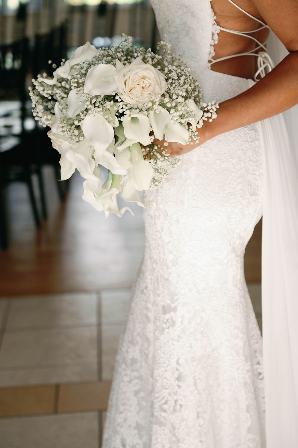 white rose orchid and baby's breath bouquet