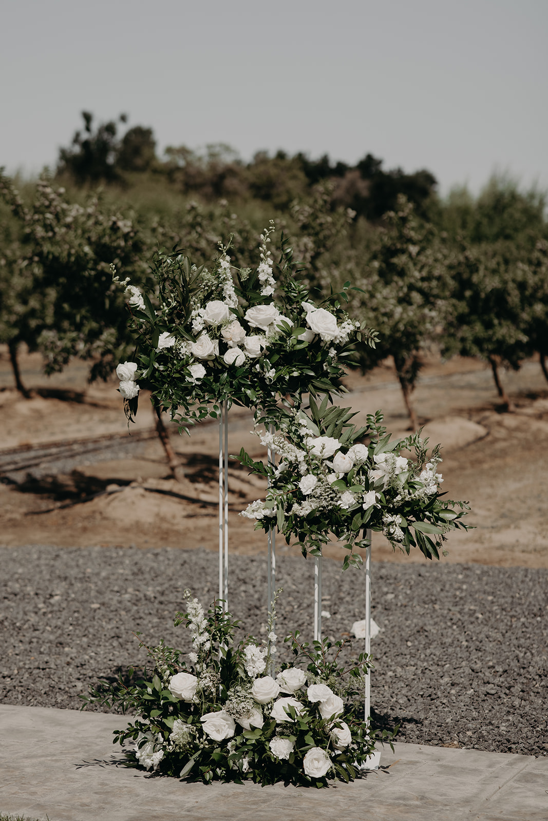 white flower arrangements on candelabras