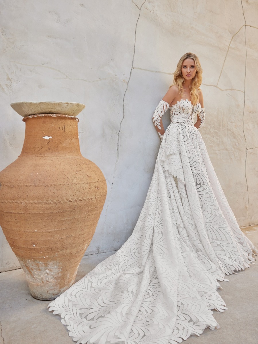 Lace, crepe, and satin are transformed into elegant silhouettes with a contemporary twist.