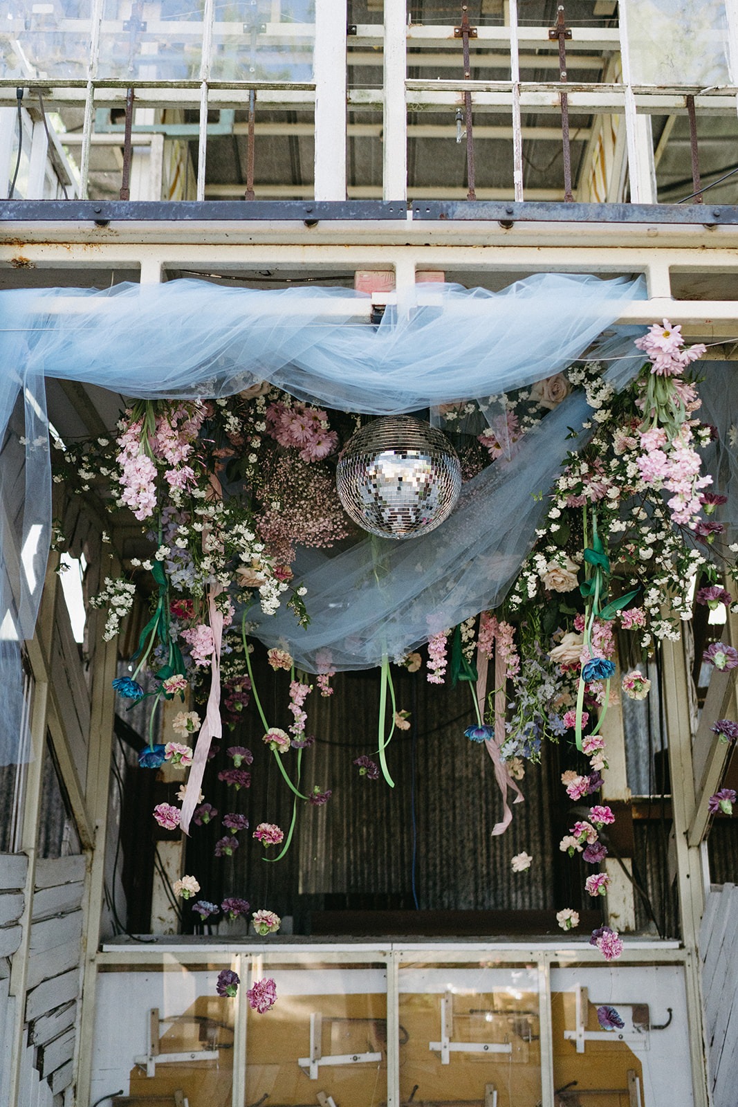 disco and floral themed pastel wedding alter