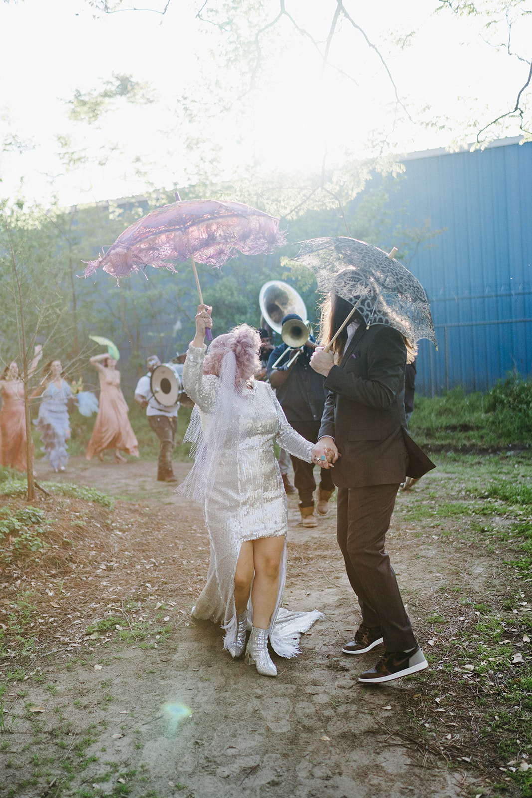 second line in new orleans with bride in silver sequin dress