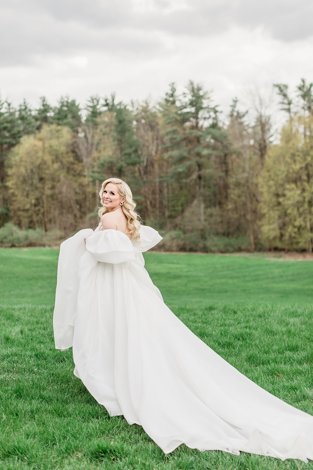 Billowing timeless wedding dress with off the shoulder sleeves
