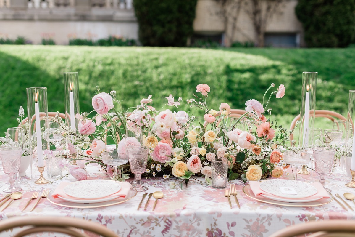 Garden party themed wedding reception with pastel flowers