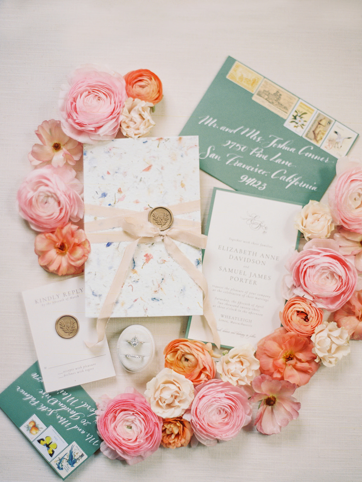 Pastel floral wedding invitation suite with flowers and ribbons