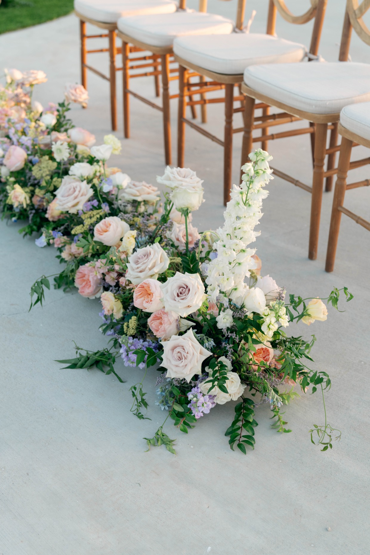 pink white and purple wedding ceremony arrangements