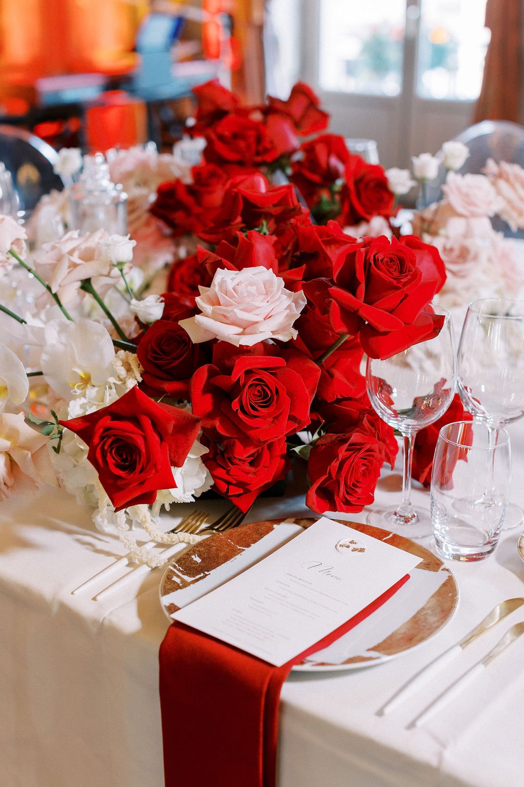 Red and dusty pink rose centerpiece for reception table 