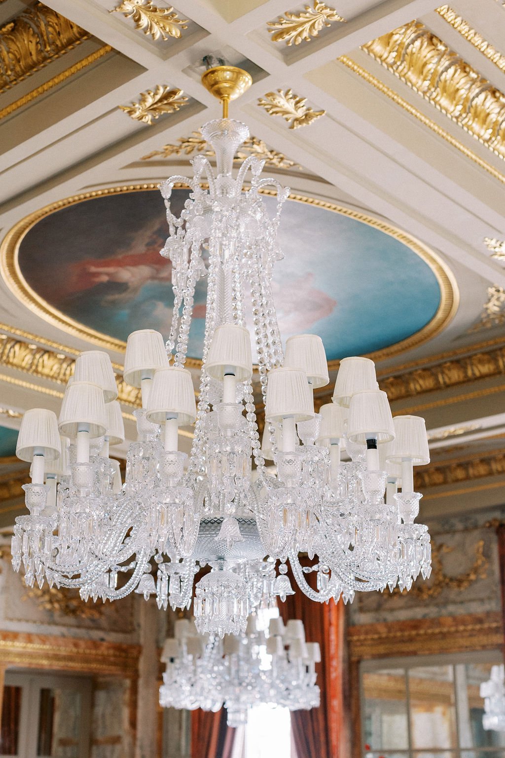 Luxury vintage crystal chandeliers at glamorous wedding venue