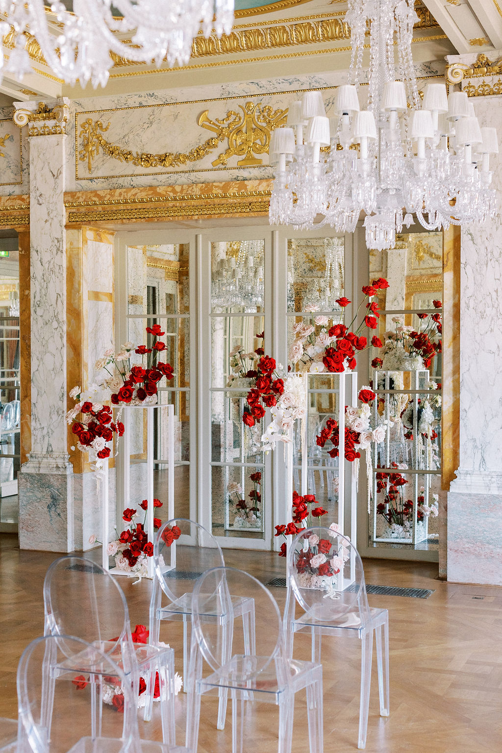 Glamorous red, pink, and white rose ceremony in French hotel