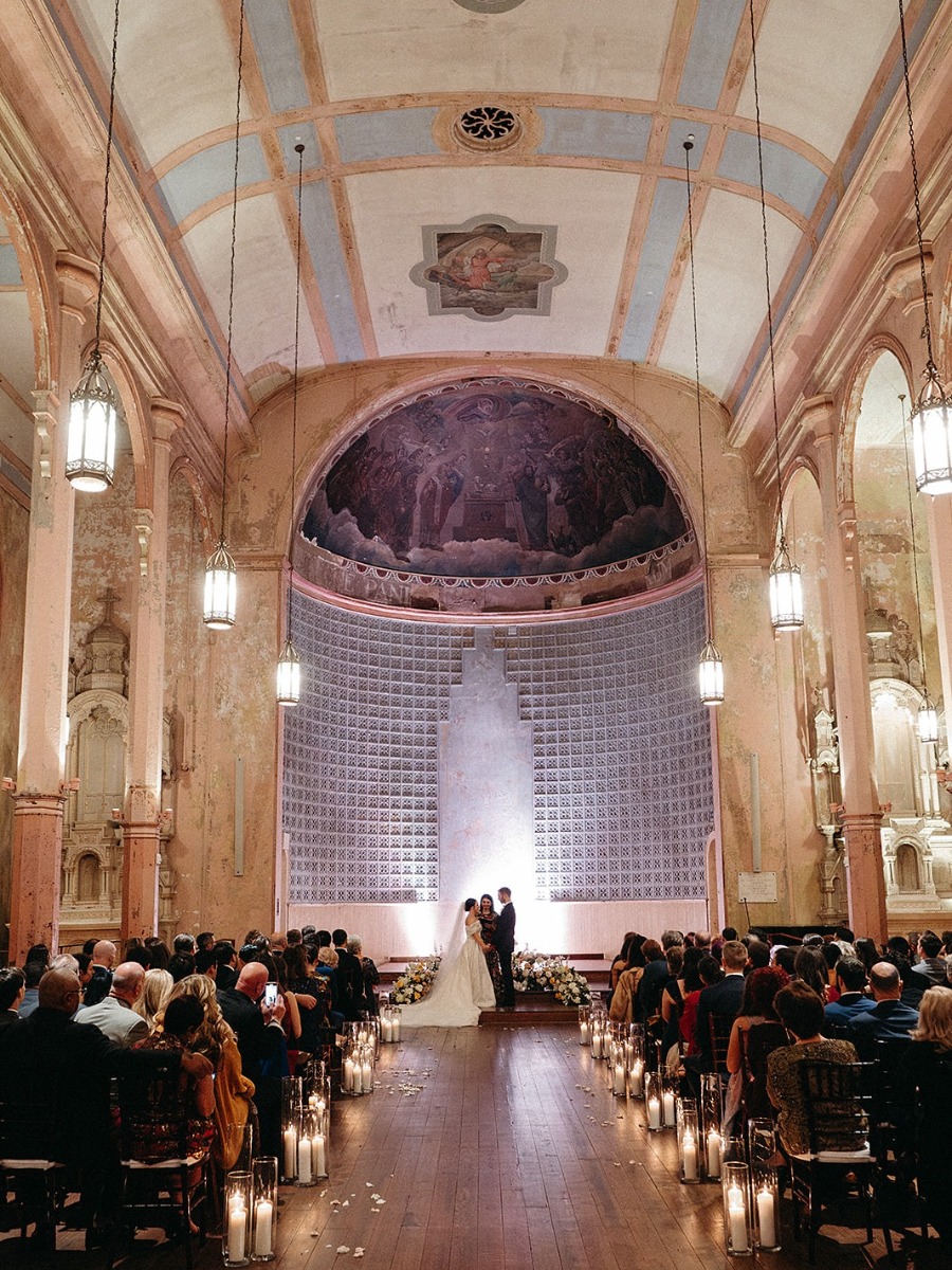 A muted rainbow wedding in NOLA with striking balloon installation