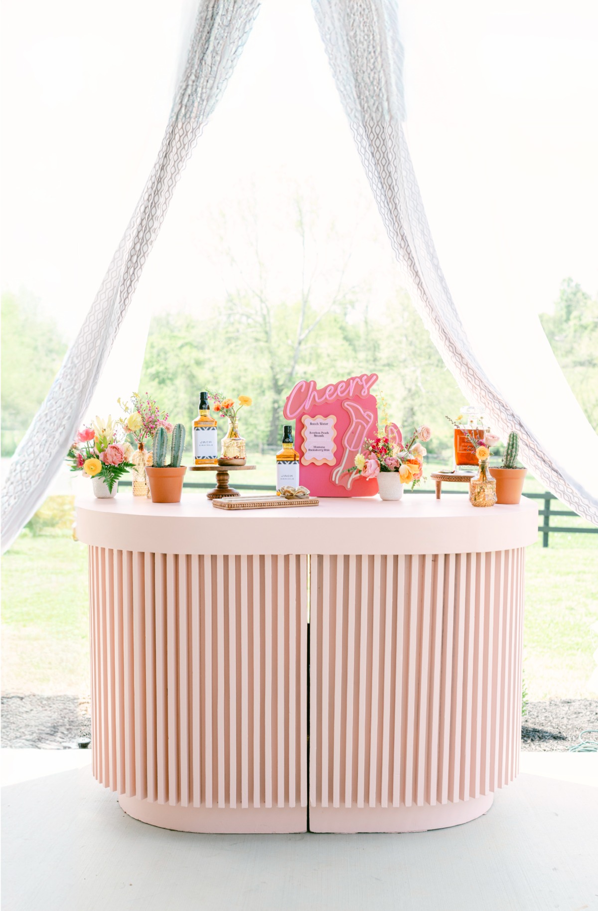 pink western-inspired wedding bar