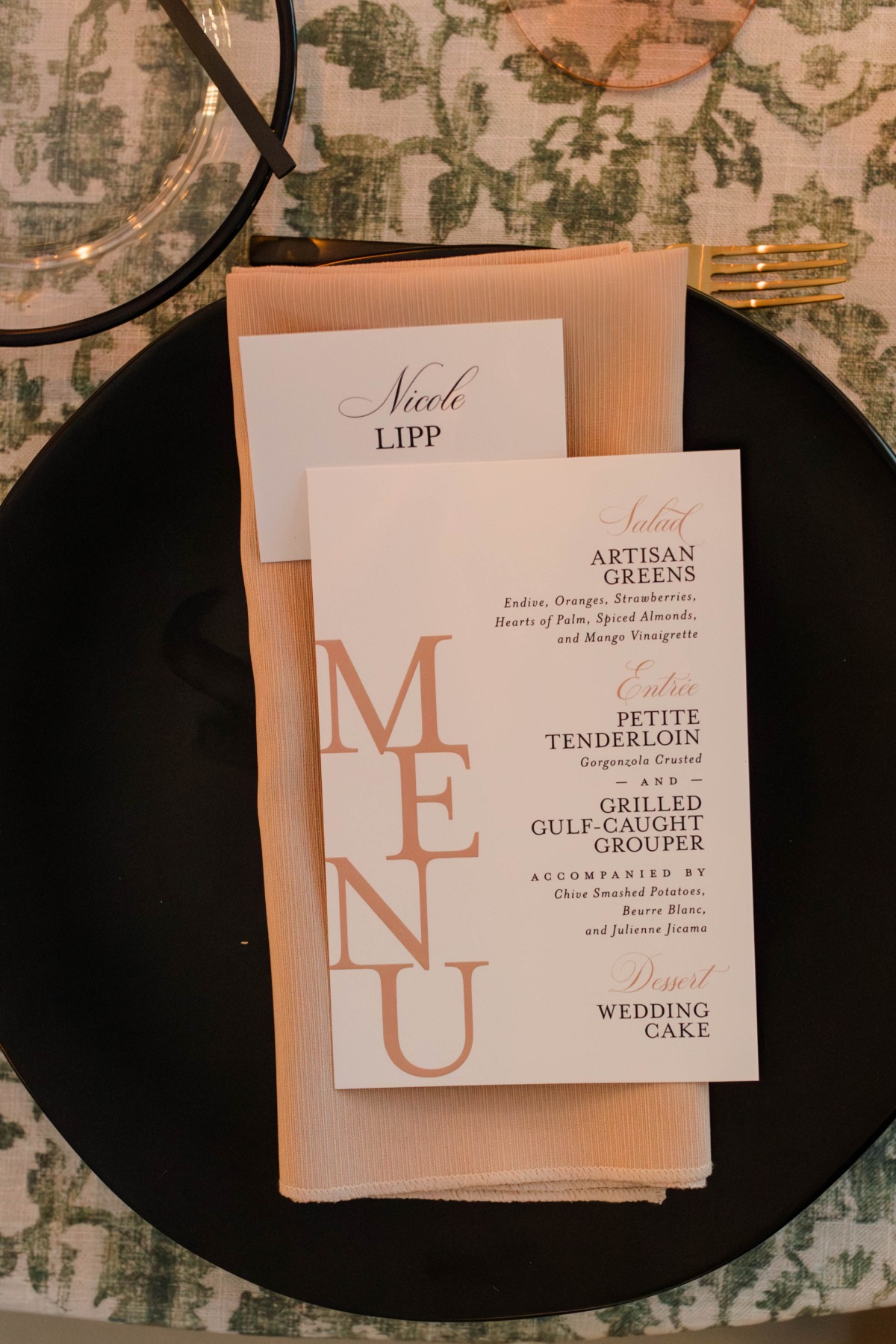 peach and black place setting