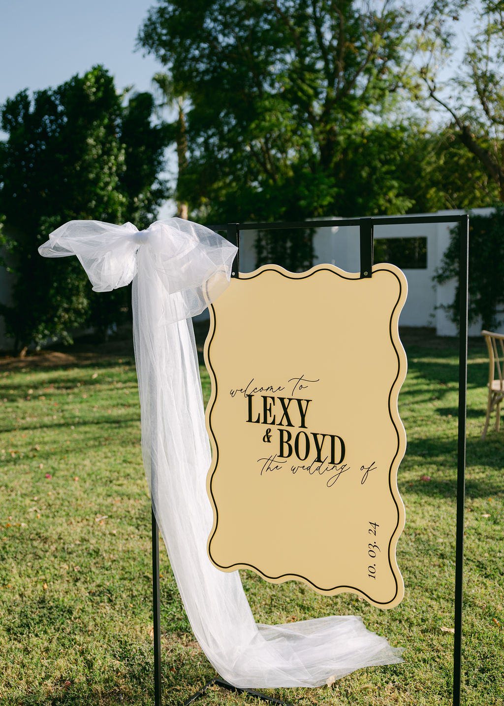 wedding welcome sign with large tulle bow