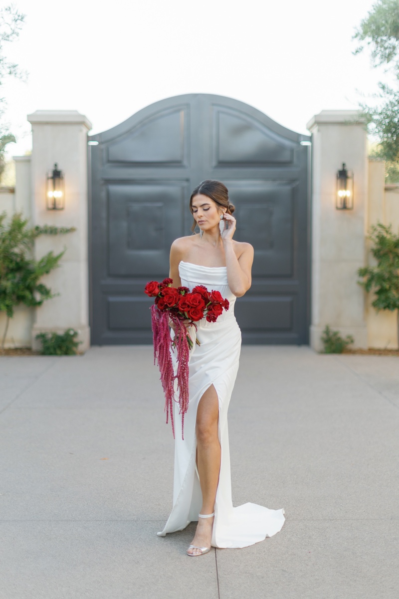 bride with red rose bouquet