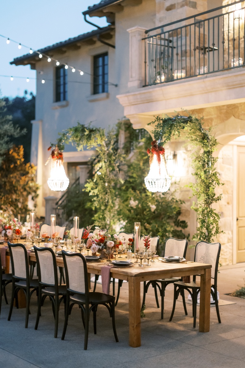 hanging chandelier over outdoor wedding table