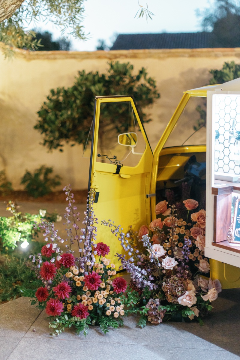 floral installation with vintage car