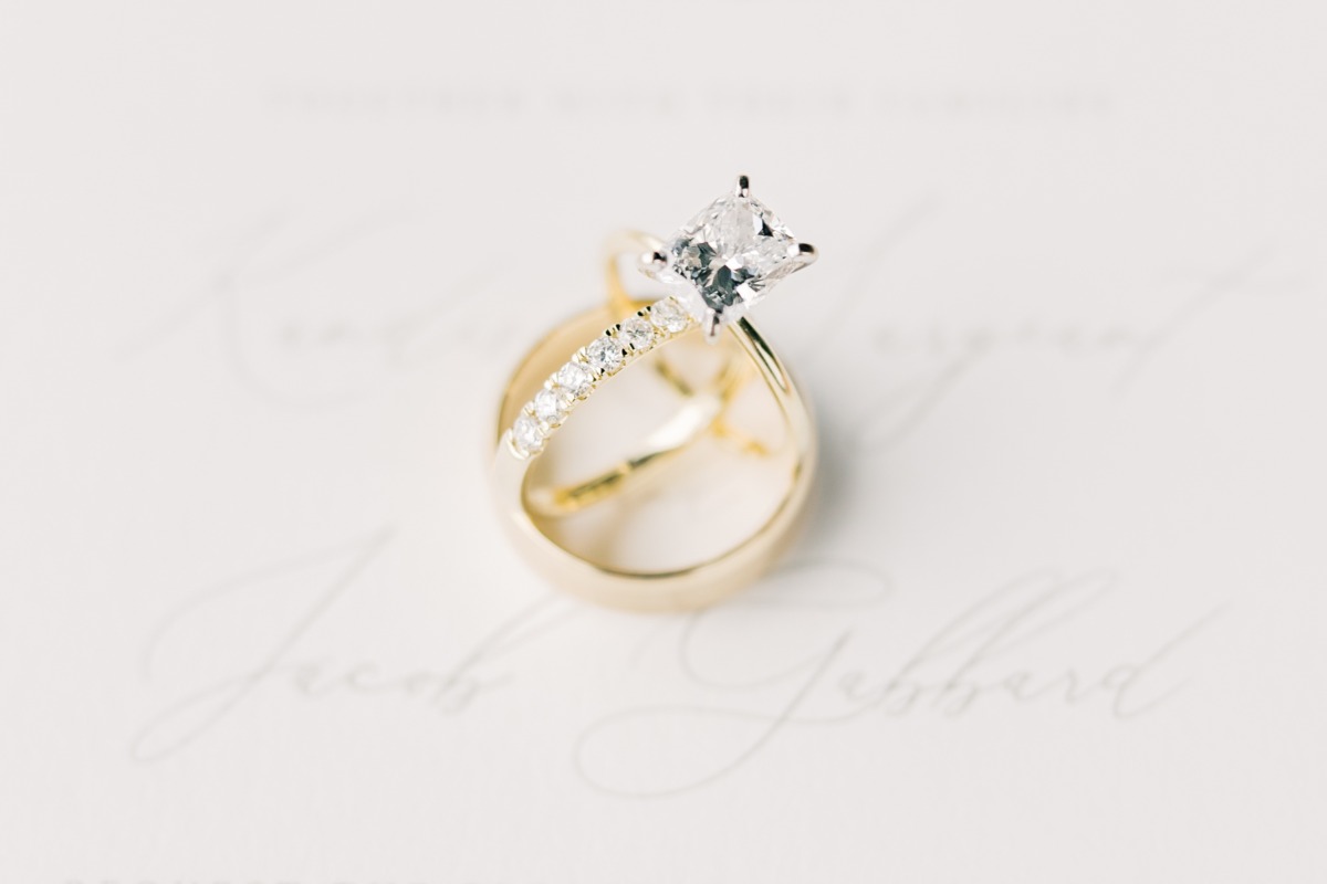 east west princess cut diamond engagement ring and gold band
