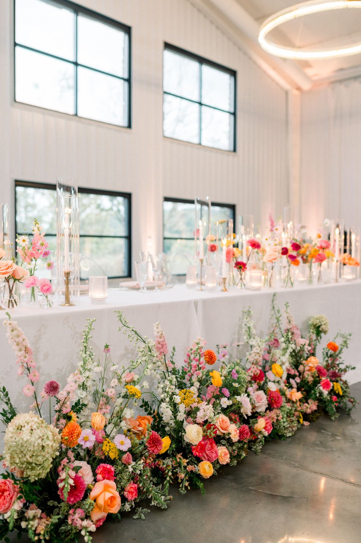bright flowers for a white barn wedding