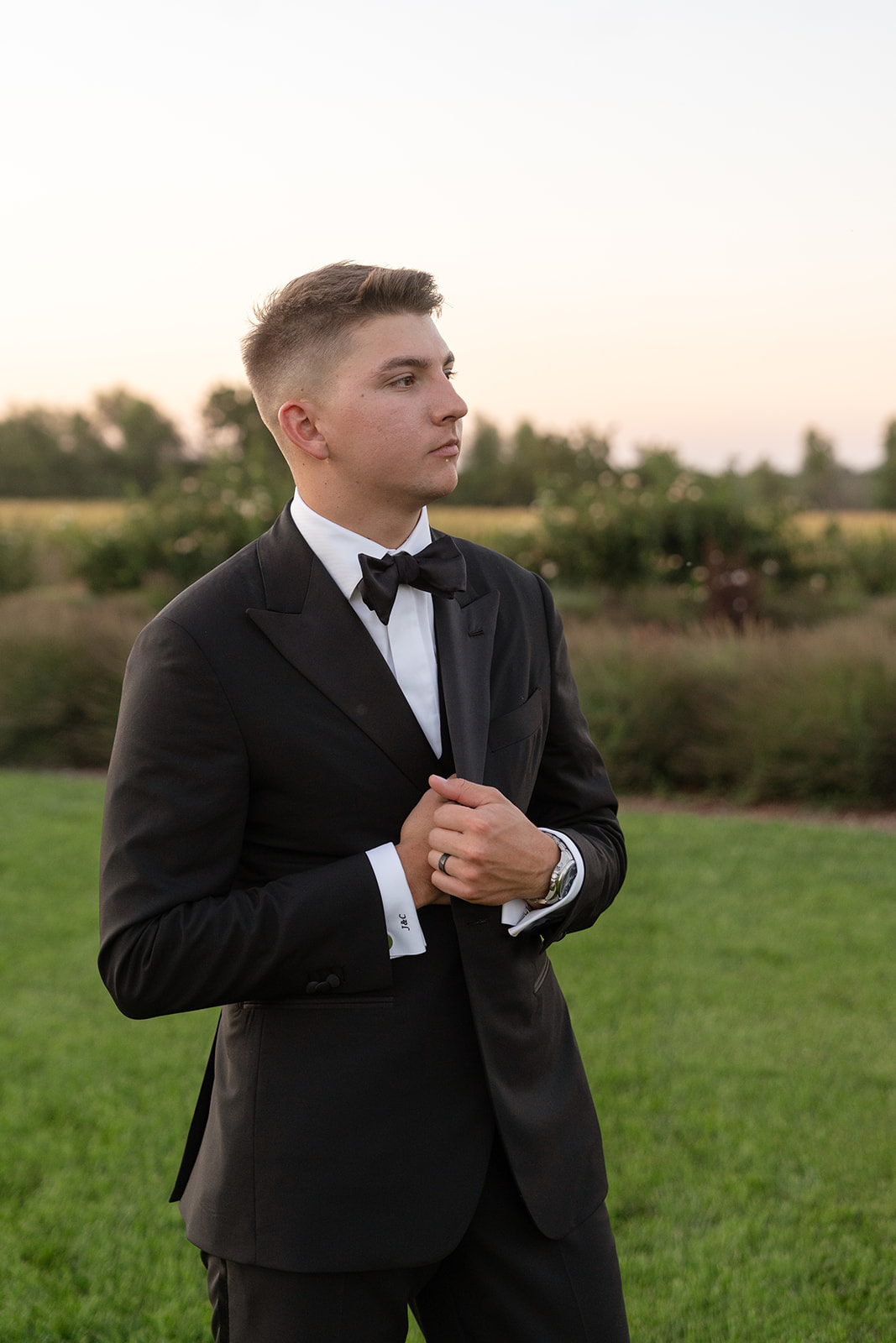 groom in black tux