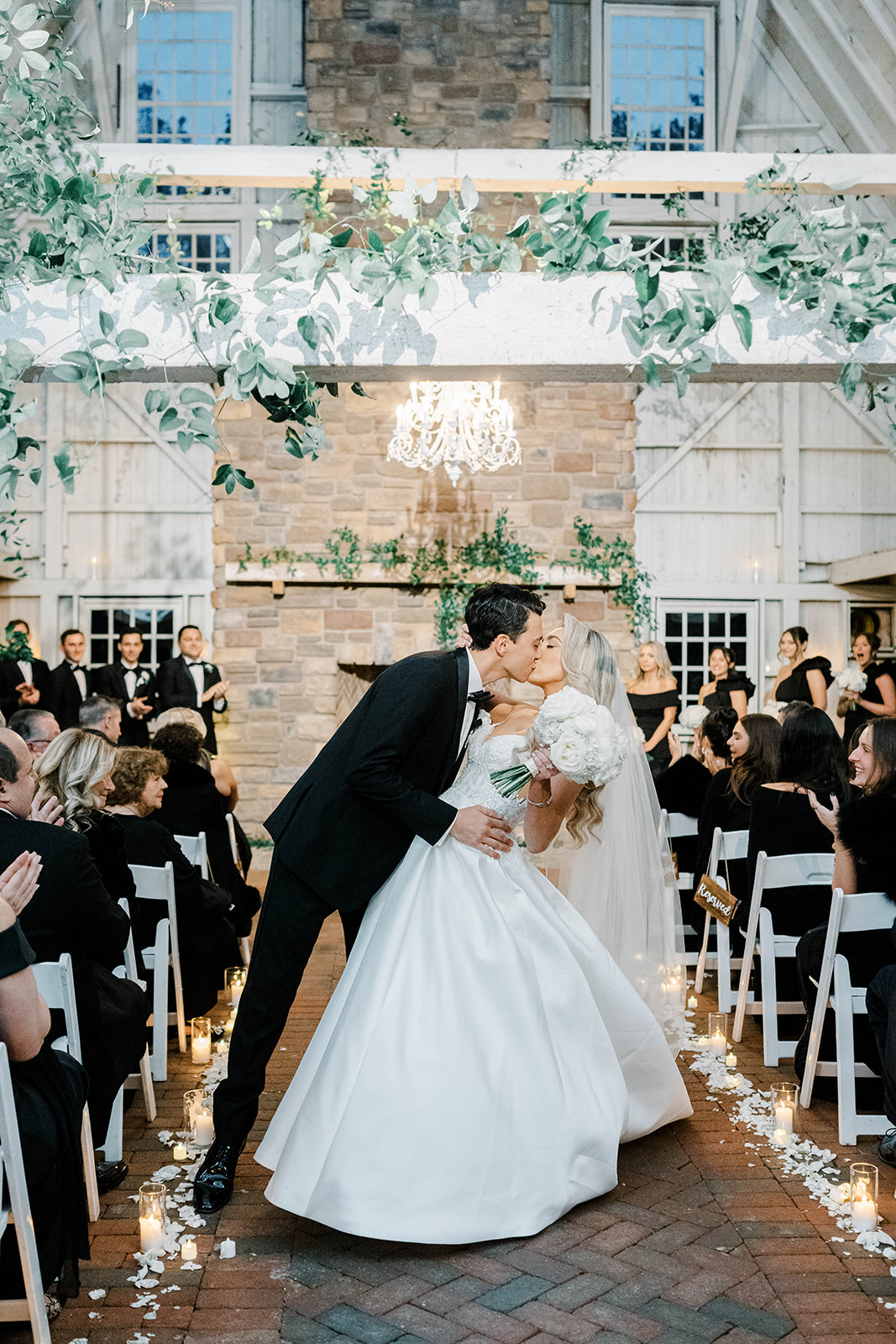 white rose lined aisle