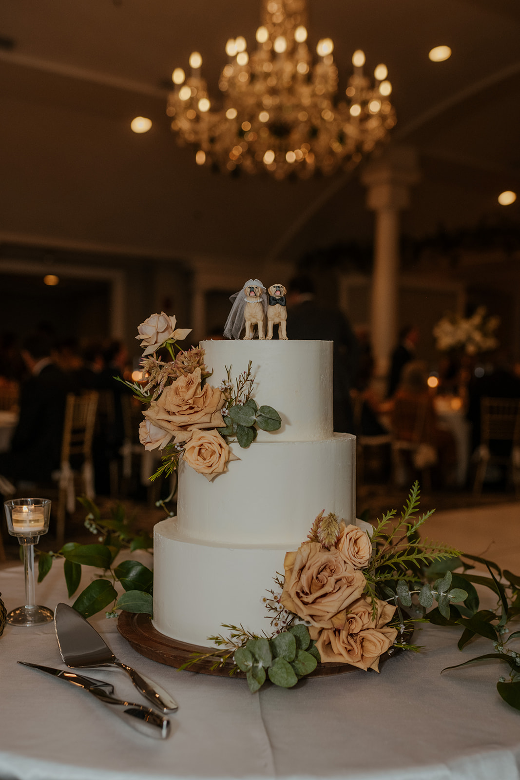 minimalist three tier wedding cake with dog figures
