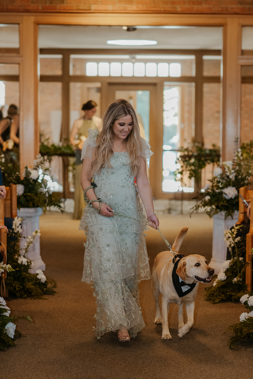 dog walking down the aisle at wedding
