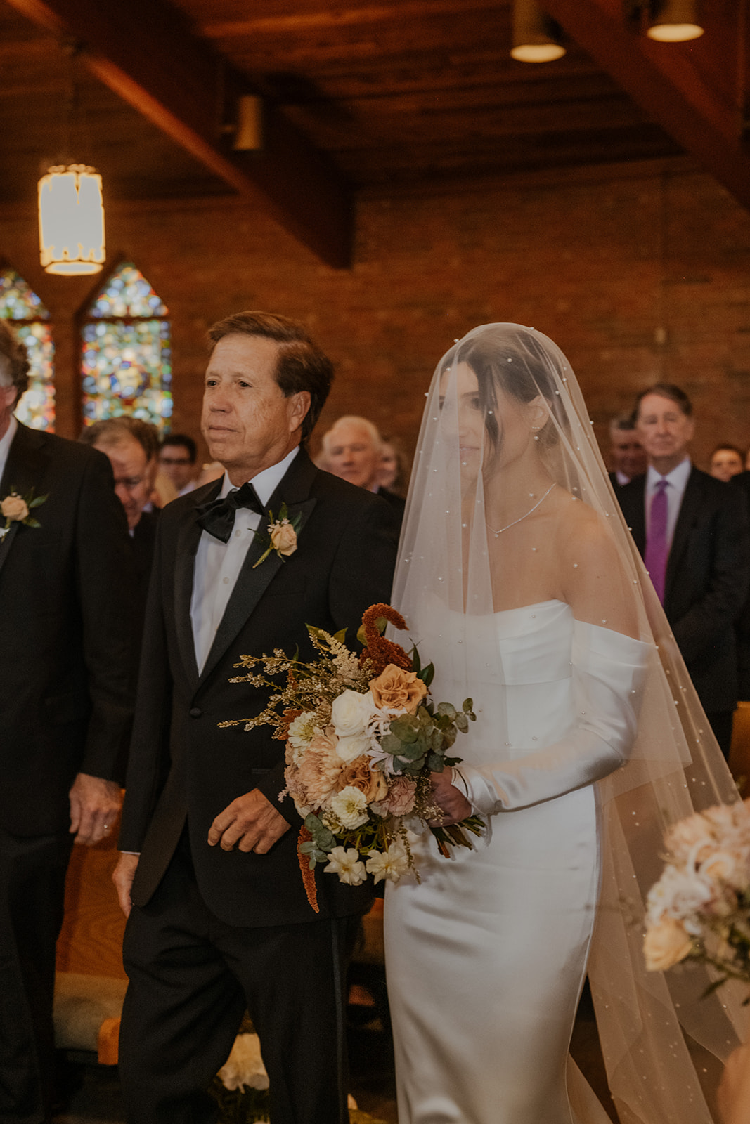 father walking daughter down the aisle at wedding