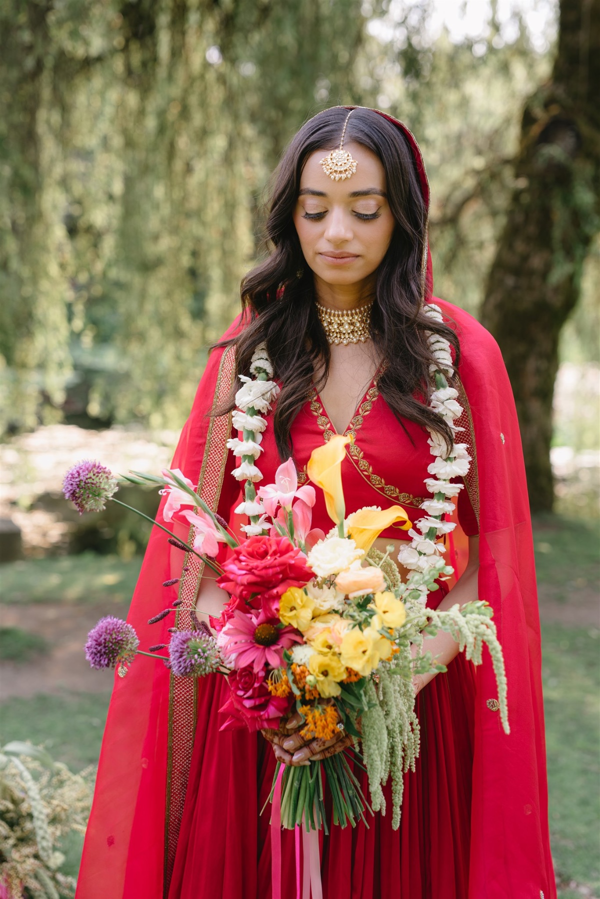 red Indian bridal dress with gold jewelry
