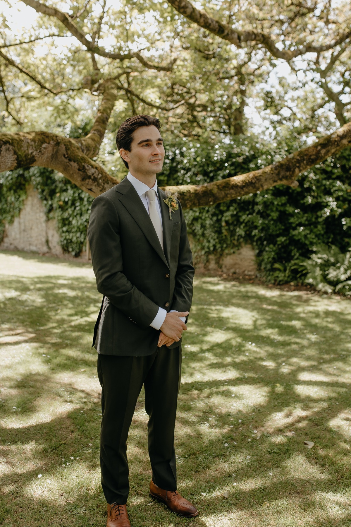groom in green suit
