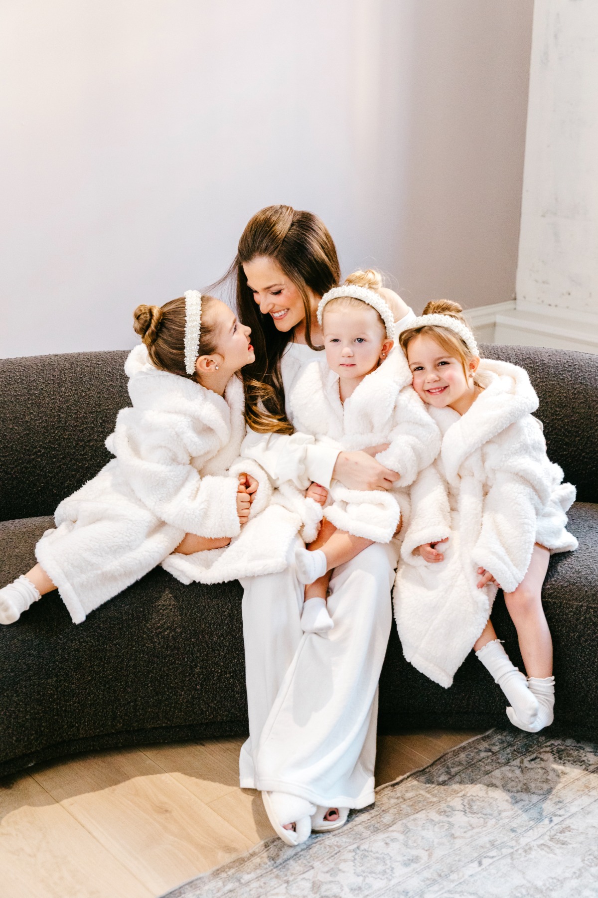 bride getting ready with flower girls