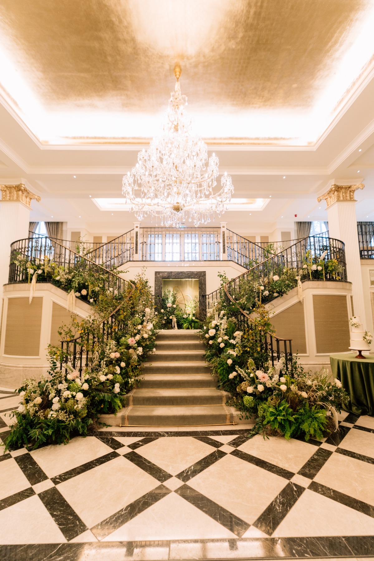 green and white floral installation on staircase