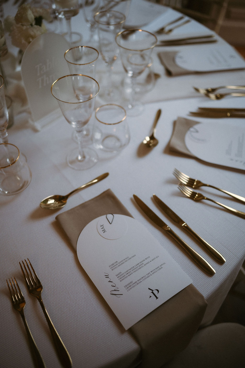 sand and gold place settings