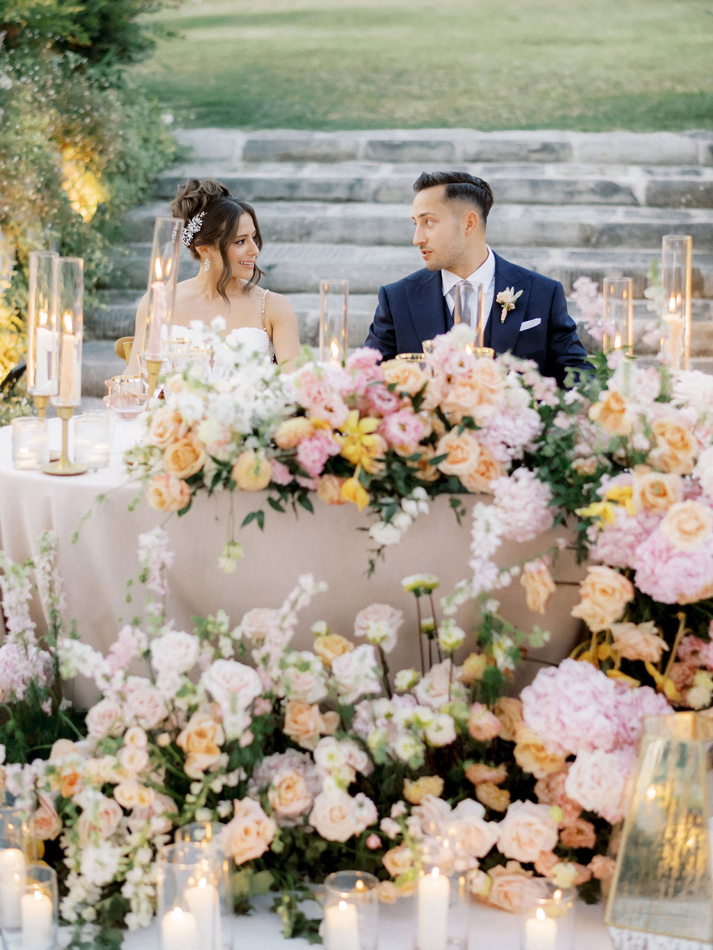 pastel floral arrangement for sweetheart table