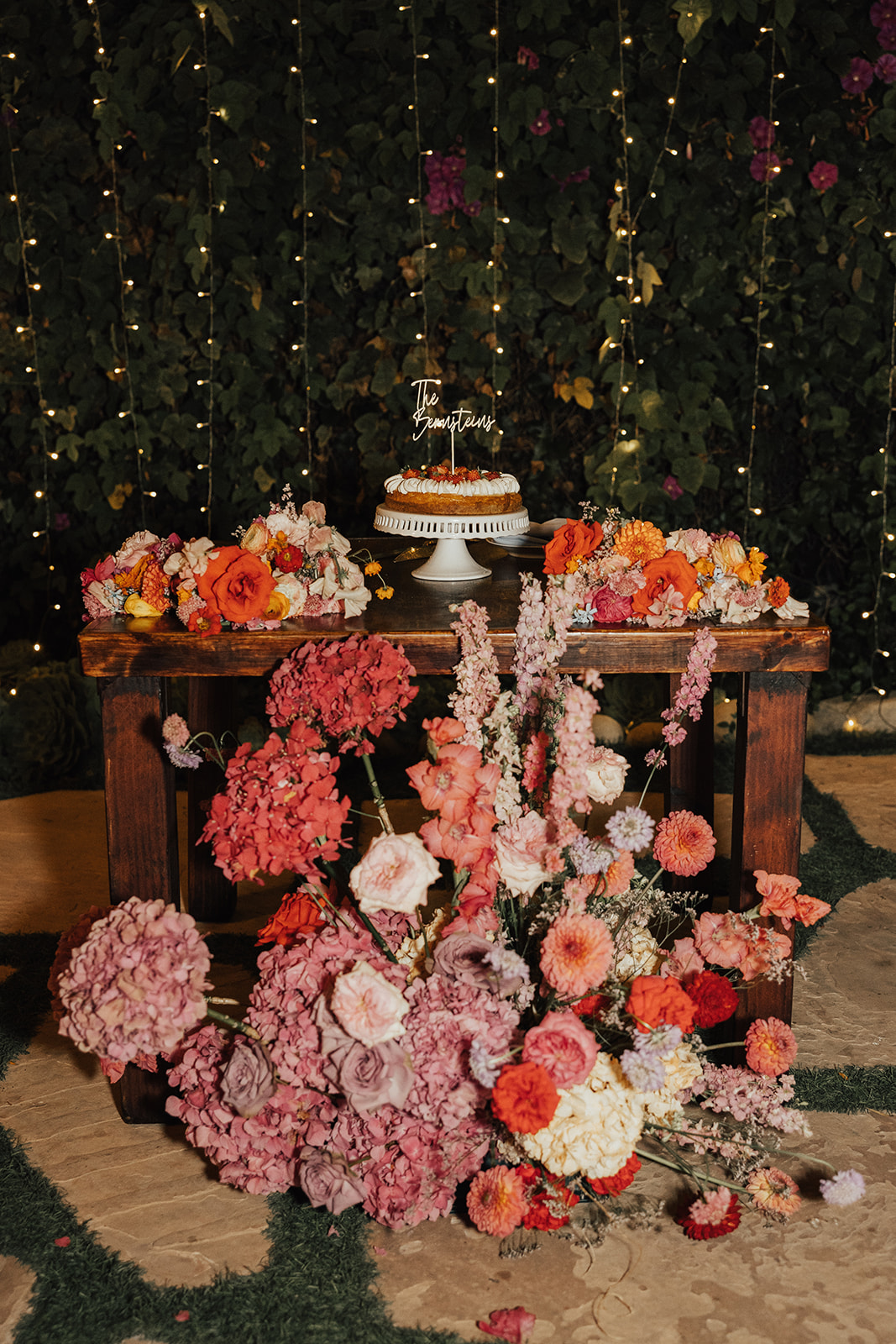 large floral arrangements for cake display at wedding
