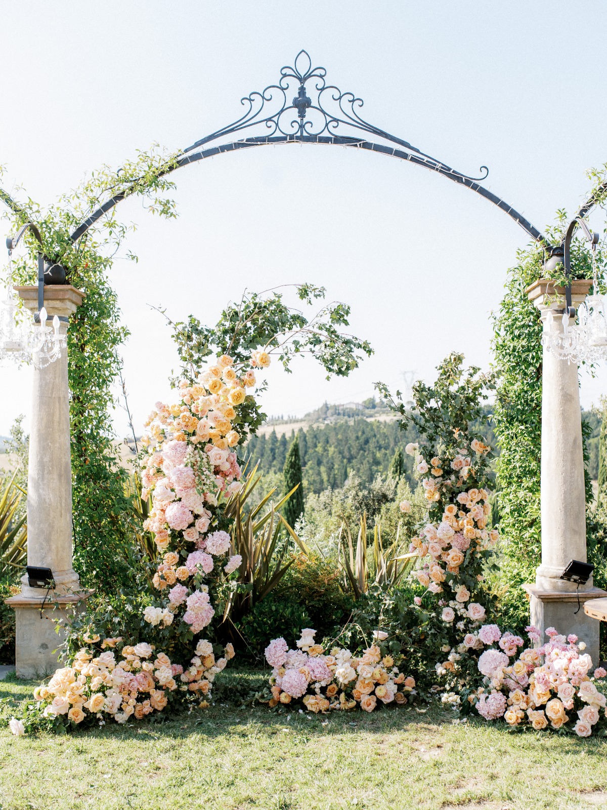pink and peach wedding floral arch