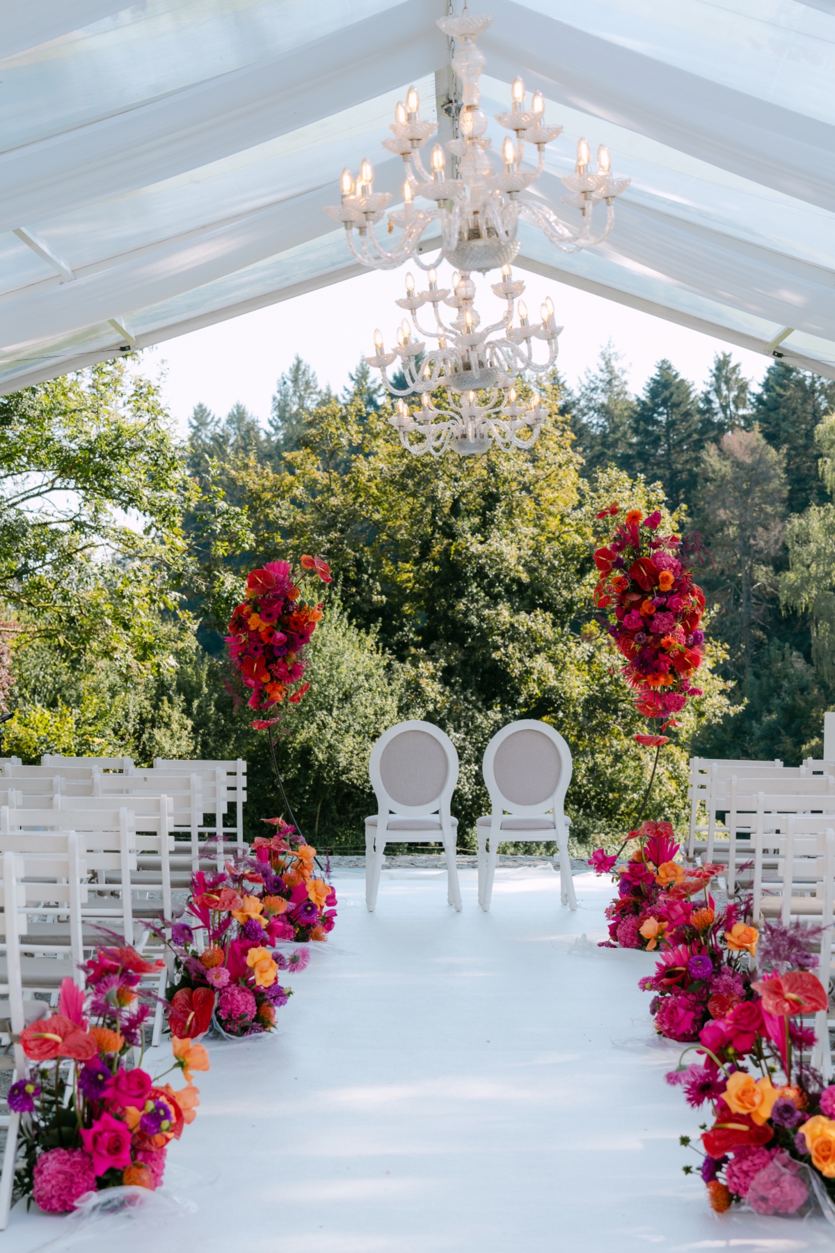 jewel tone florals with white ceremony backdrop