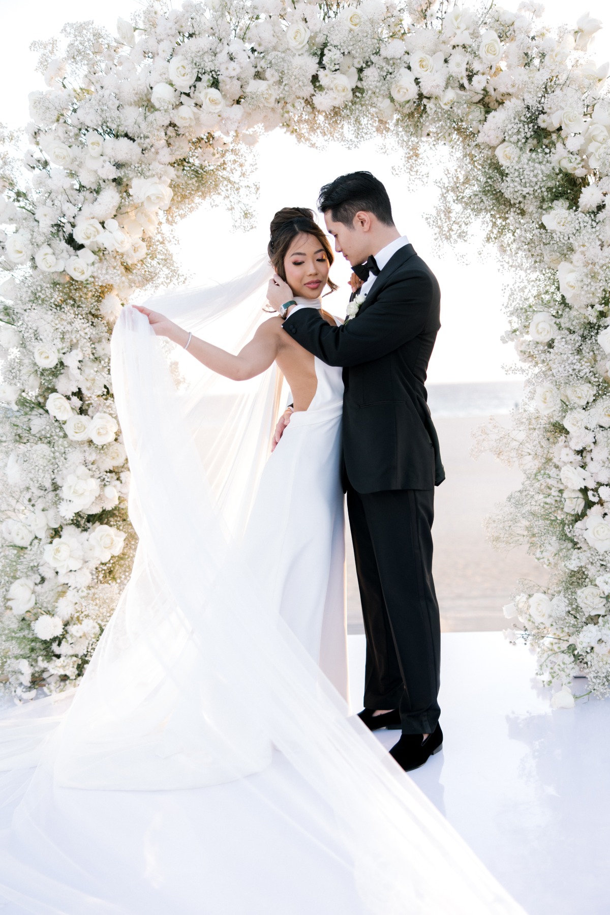 white rose and babys breath floral arch for wedding