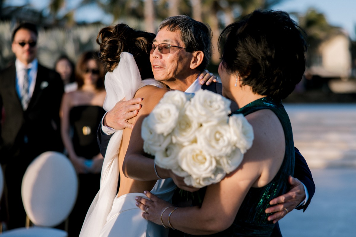 both parents walk bride down the aisle