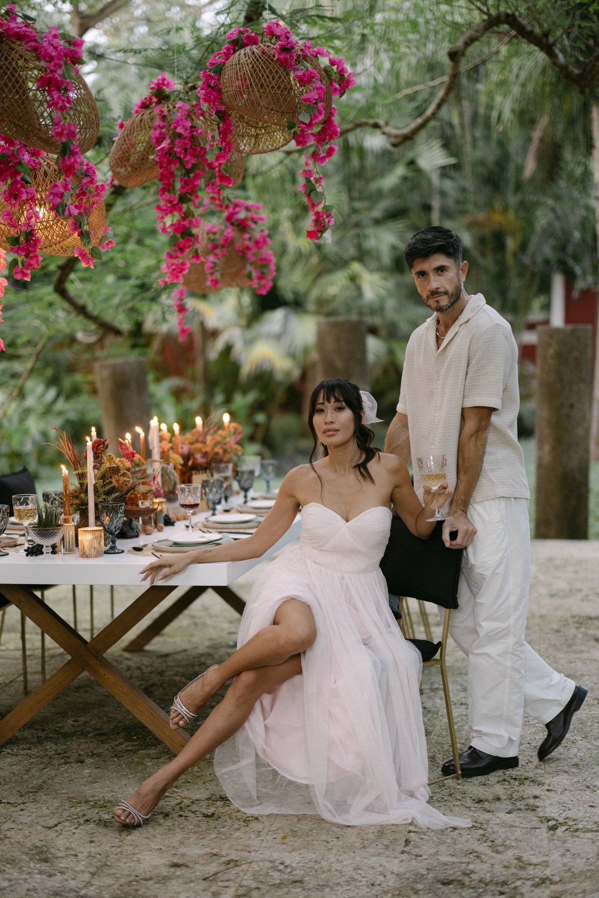hanging rattan lighting with bright pink flowers