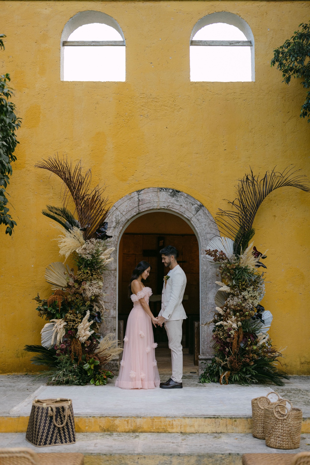 moody tropical wedding flower columns
