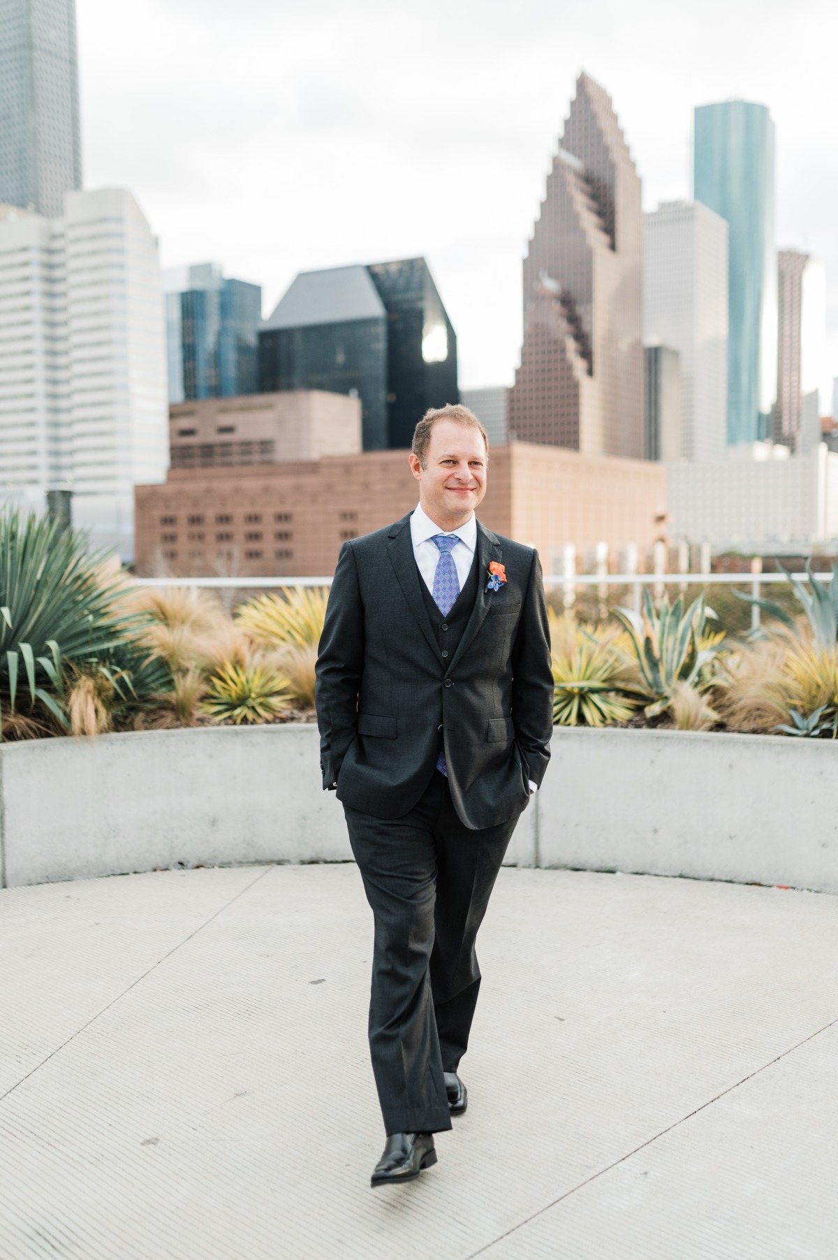 groom in three piece suit