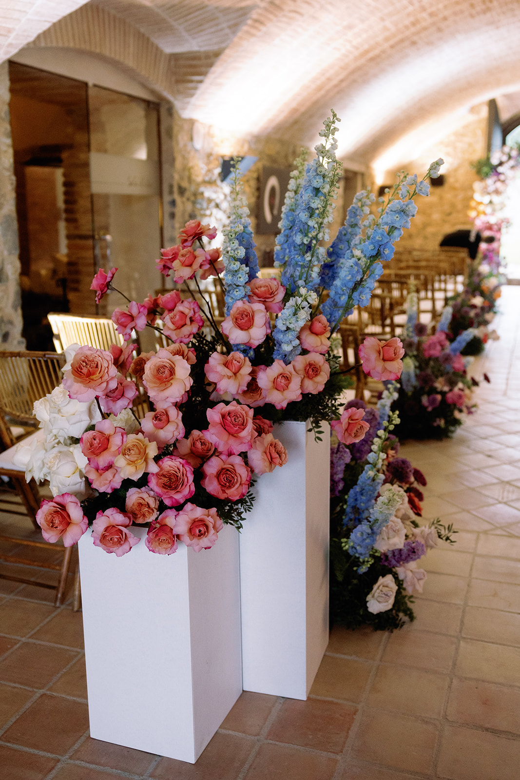 rainbow wedding ceremony aisle floral arrangements