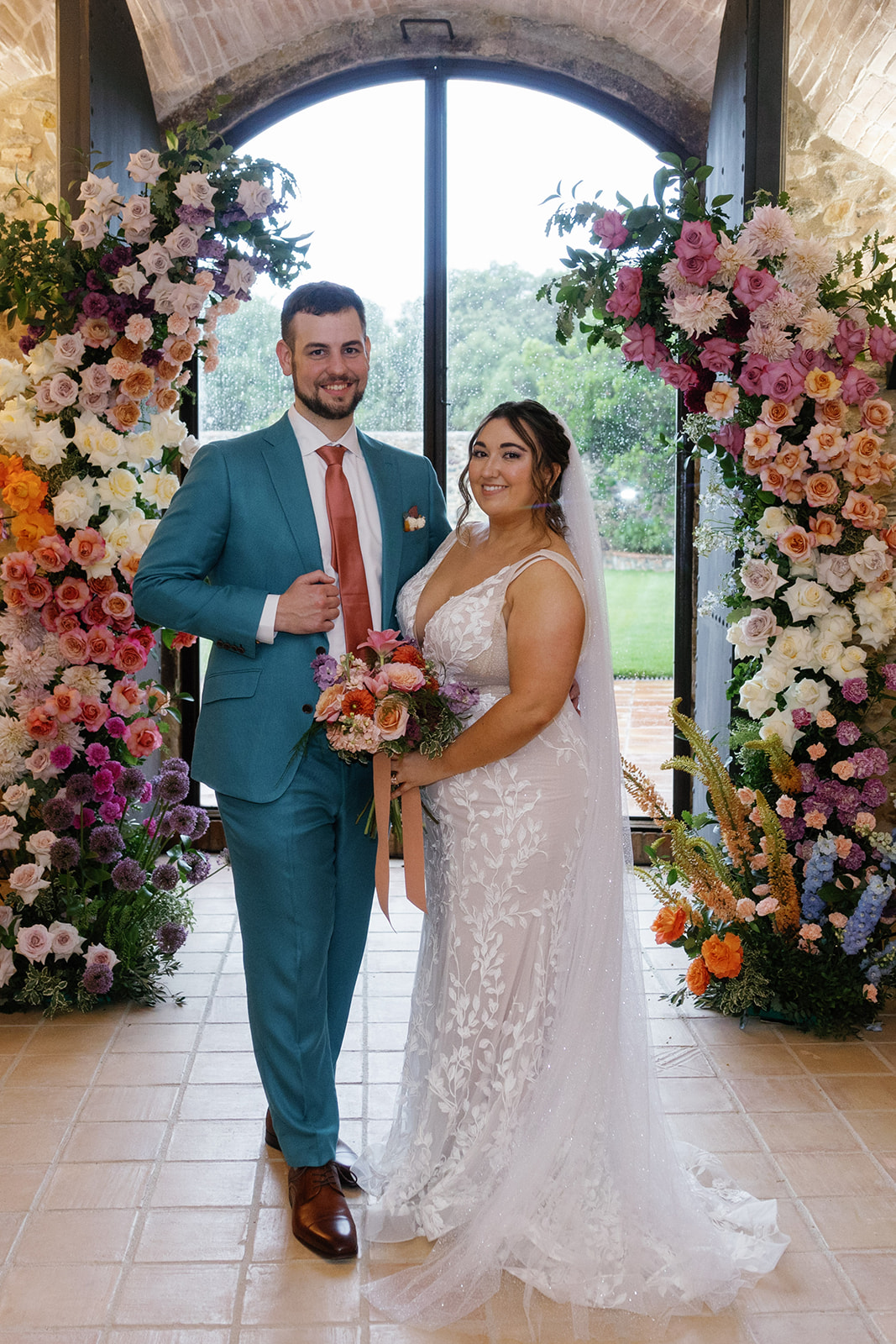 muted rainbow asymmetrical floral arches