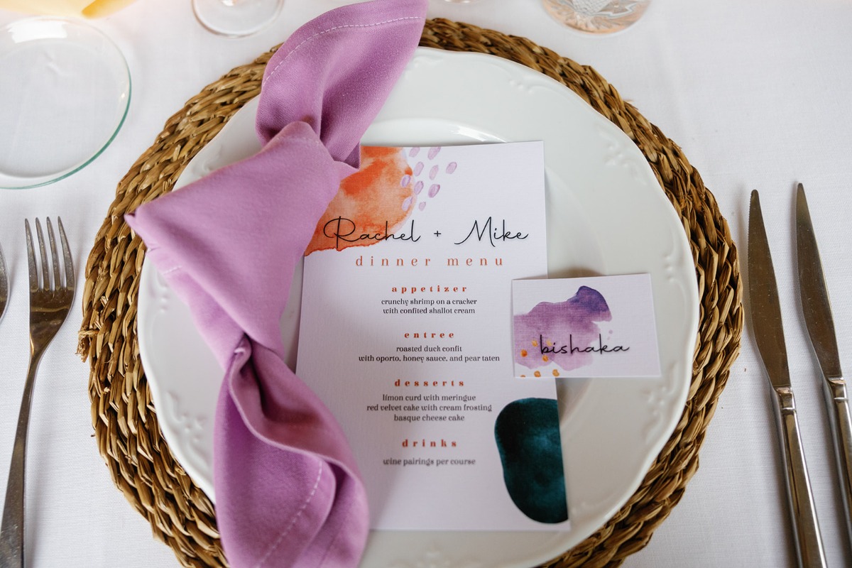 purple linens and watercolor wedding dinner menus
