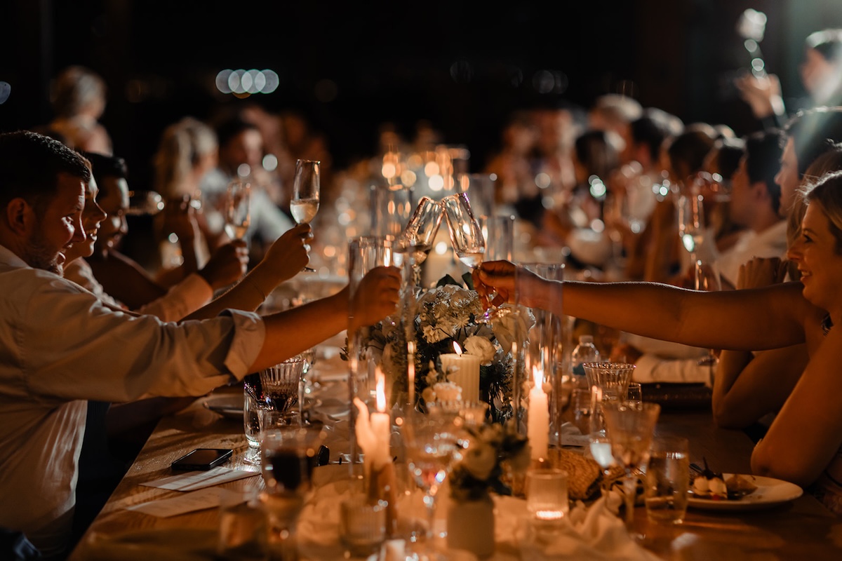 reception table of people cheersing glasses