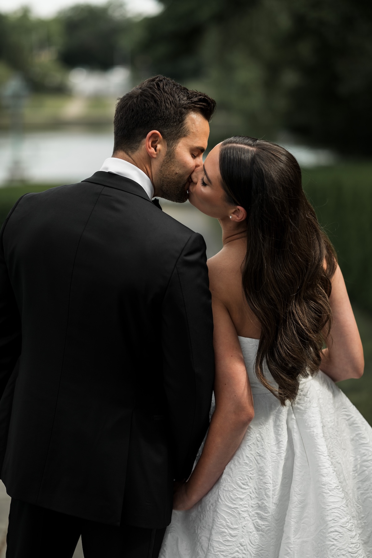 Wedding Couple kissing from the back