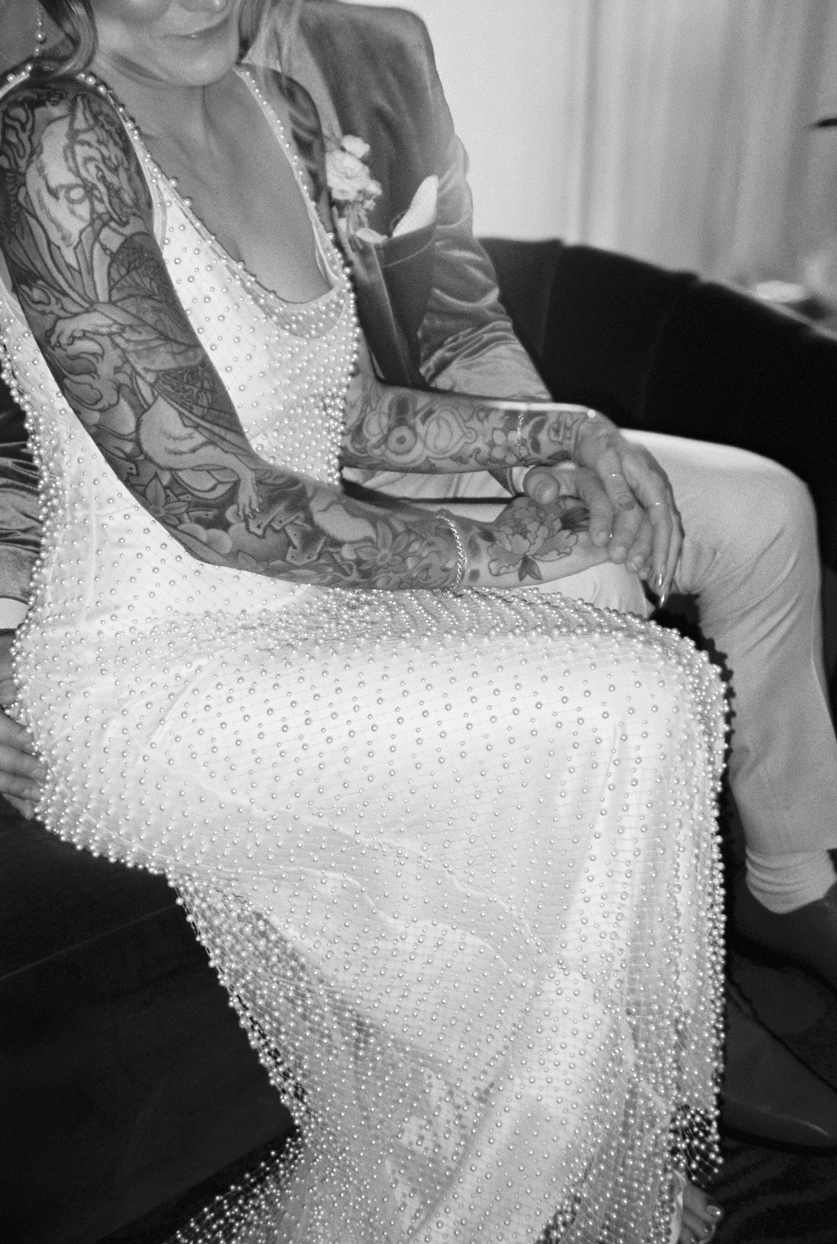 black and white photo of couple with tattoos