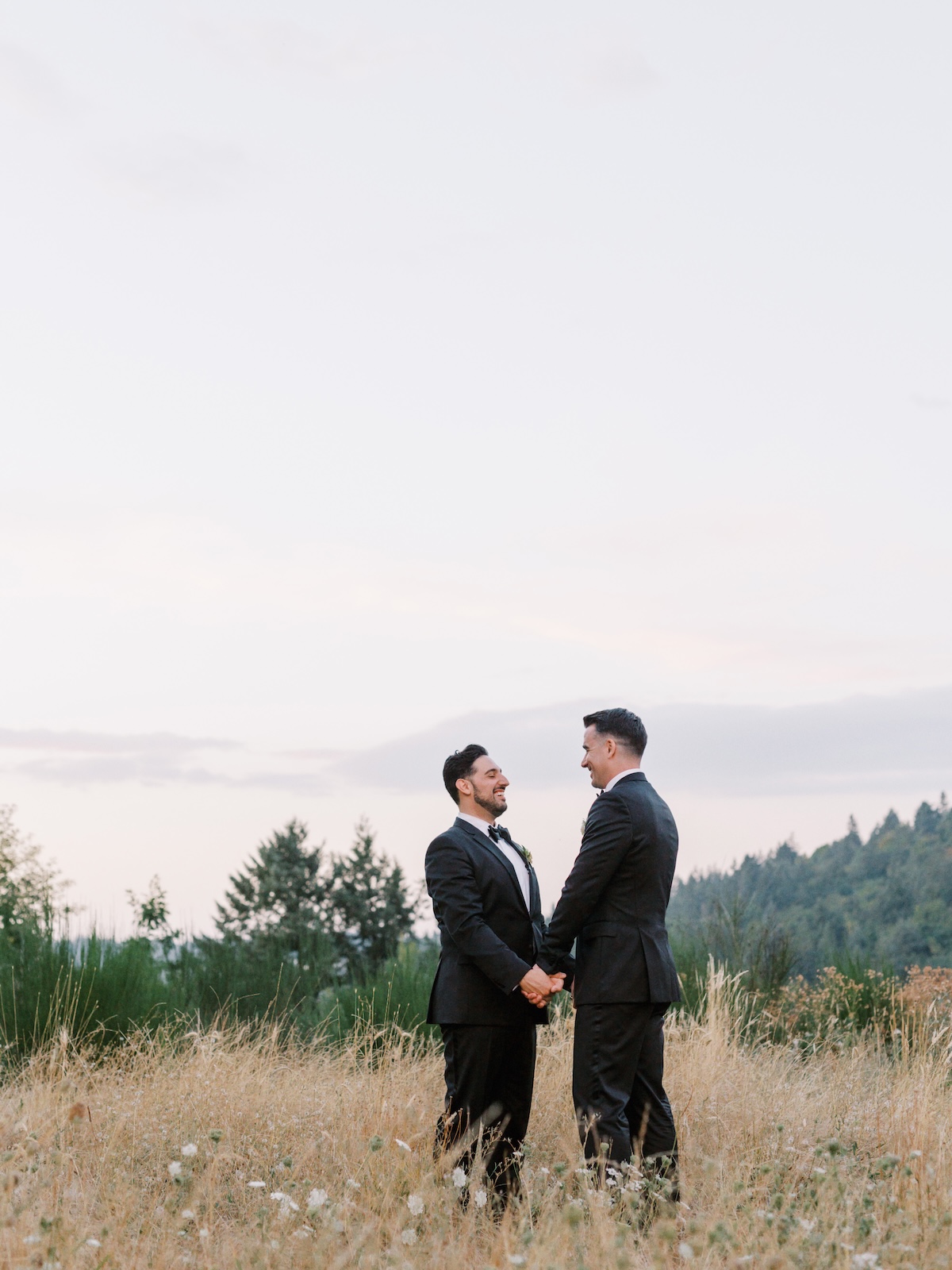 couple on cliff holding hands
