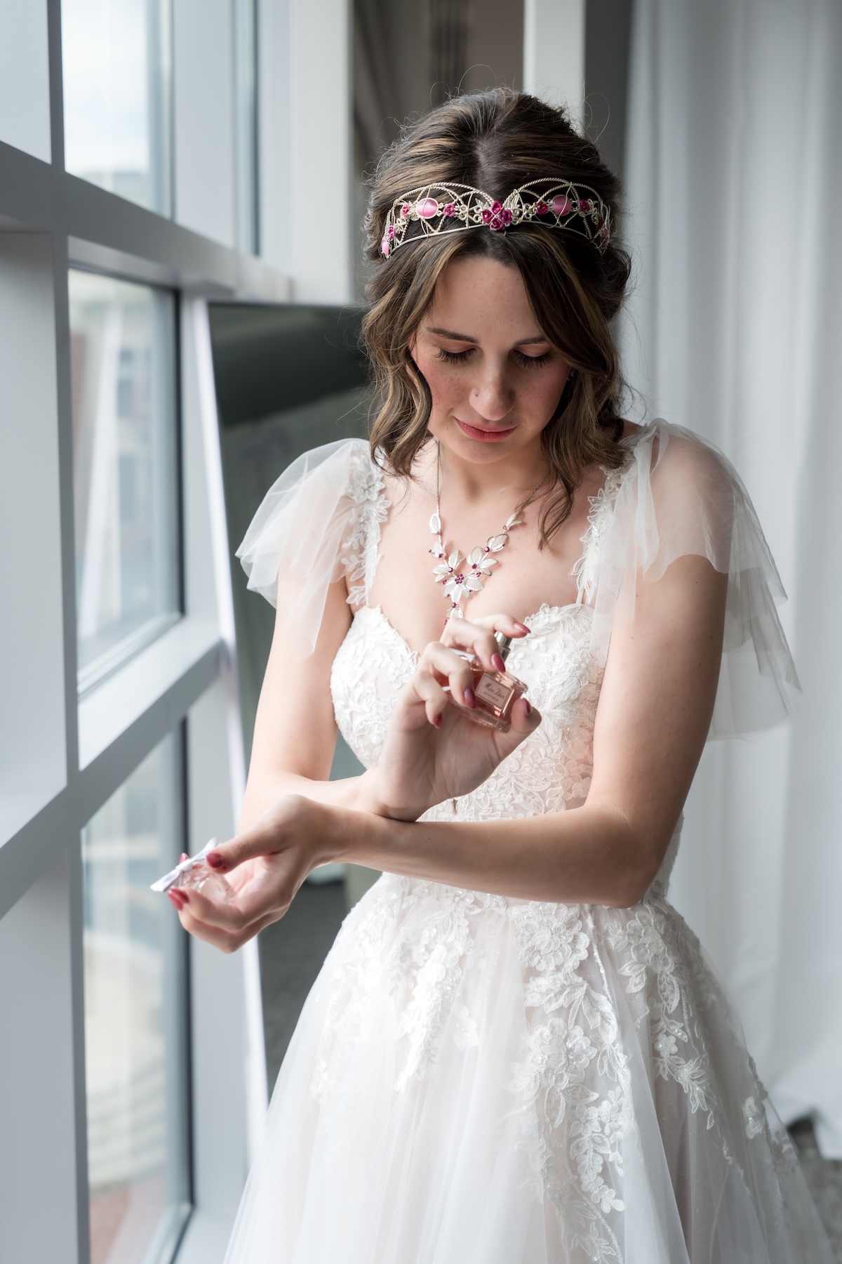 bride putting on perfume