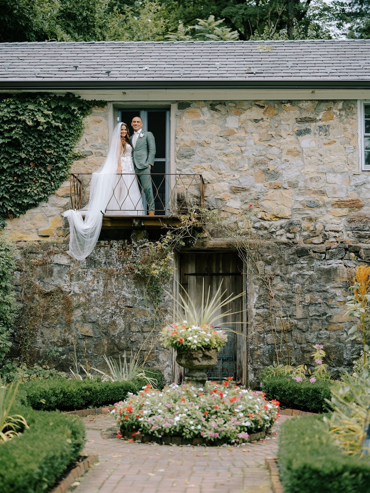 couple on balcony smiling