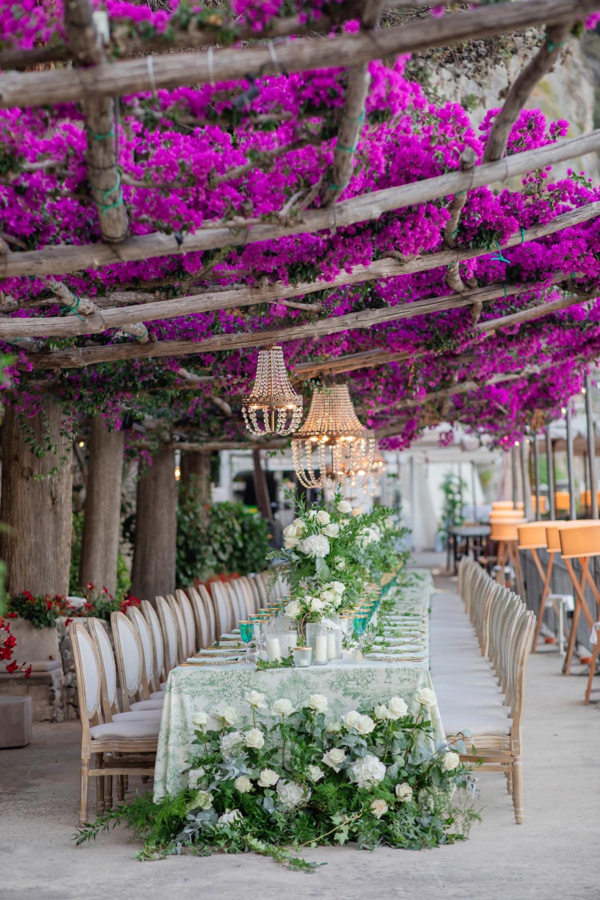 white roses and greenery centerpieces
